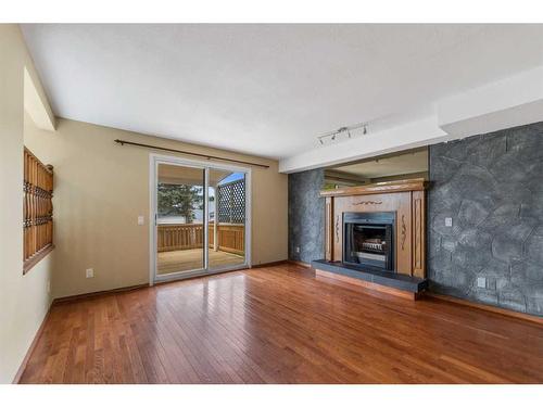 67 Tararidge Place Ne, Calgary, AB - Indoor Photo Showing Living Room With Fireplace