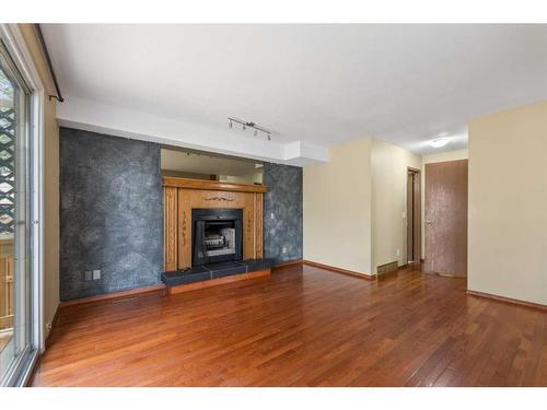 67 Tararidge Place Ne, Calgary, AB - Indoor Photo Showing Living Room With Fireplace