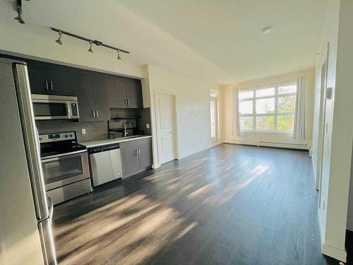 404-25 Auburn Meadows Avenue Se, Calgary, AB - Indoor Photo Showing Kitchen With Stainless Steel Kitchen