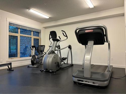 101-15 Aspenmont Heights Sw, Calgary, AB - Indoor Photo Showing Gym Room