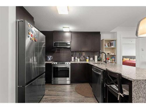 101-15 Aspenmont Heights Sw, Calgary, AB - Indoor Photo Showing Kitchen With Stainless Steel Kitchen With Upgraded Kitchen