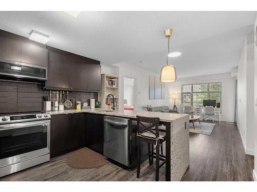 101-15 Aspenmont Heights Sw, Calgary, AB - Indoor Photo Showing Kitchen With Stainless Steel Kitchen With Upgraded Kitchen