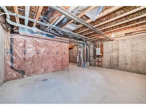 144 Everridge Gardens Sw, Calgary, AB - Indoor Photo Showing Basement