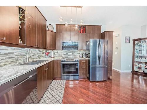 144 Everridge Gardens Sw, Calgary, AB - Indoor Photo Showing Kitchen With Double Sink With Upgraded Kitchen