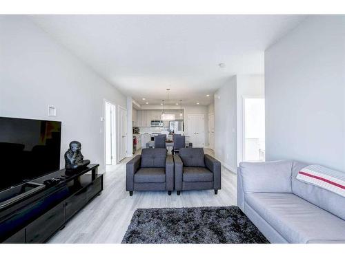 501-71 Shawnee Common Sw, Calgary, AB - Indoor Photo Showing Living Room