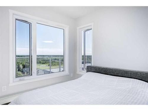 501-71 Shawnee Common Sw, Calgary, AB - Indoor Photo Showing Bedroom