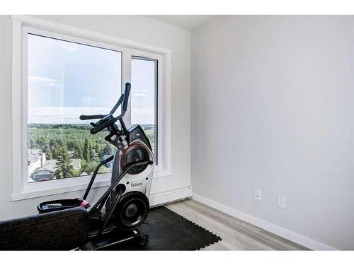 501-71 Shawnee Common Sw, Calgary, AB - Indoor Photo Showing Gym Room