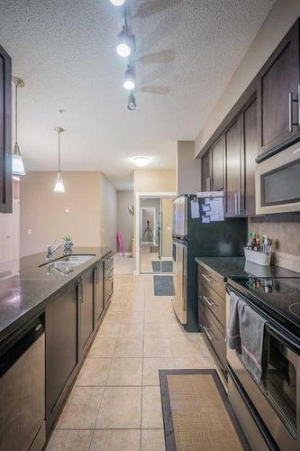 315-88 Arbour Lake Road Nw, Calgary, AB - Indoor Photo Showing Kitchen With Stainless Steel Kitchen