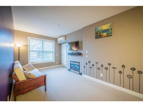 315-88 Arbour Lake Road Nw, Calgary, AB - Indoor With Fireplace