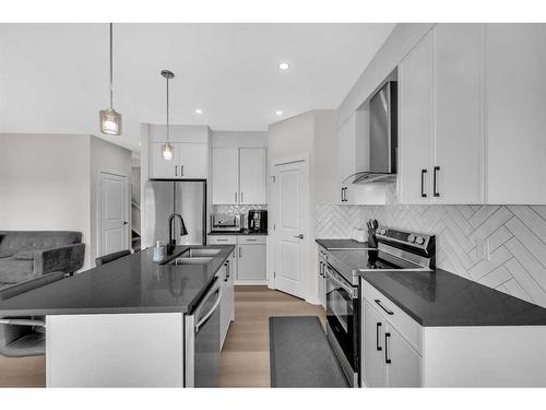 1021 Waterford Drive, Chestermere, AB - Indoor Photo Showing Kitchen With Stainless Steel Kitchen With Double Sink With Upgraded Kitchen