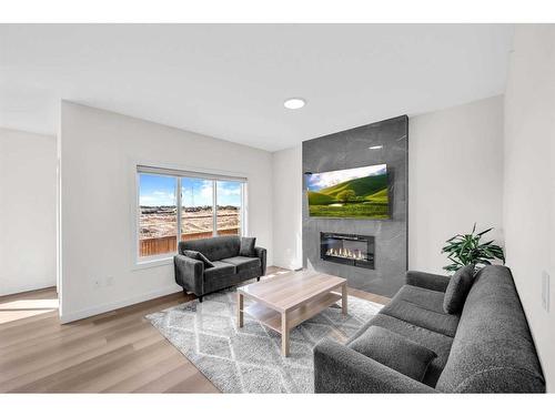 1021 Waterford Drive, Chestermere, AB - Indoor Photo Showing Living Room With Fireplace