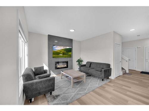 1021 Waterford Drive, Chestermere, AB - Indoor Photo Showing Living Room With Fireplace