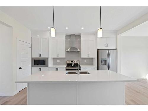 718 Bayview Hill Sw, Airdrie, AB - Indoor Photo Showing Kitchen With Double Sink With Upgraded Kitchen