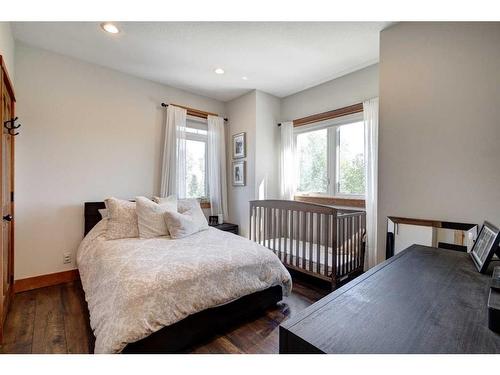 100-370025 288 Street West, Rural Foothills County, AB - Indoor Photo Showing Bedroom