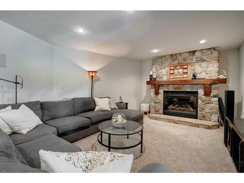 100-370025 288 Street West, Rural Foothills County, AB - Indoor Photo Showing Living Room With Fireplace