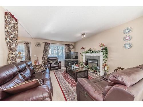 241 Covewood Circle Ne, Calgary, AB - Indoor Photo Showing Living Room With Fireplace