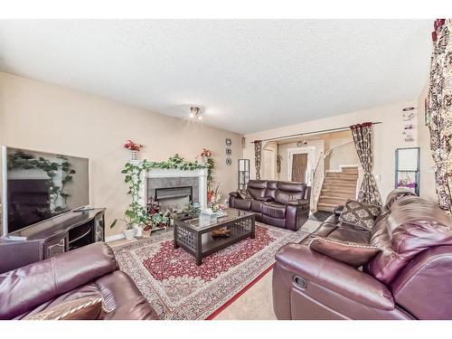 241 Covewood Circle Ne, Calgary, AB - Indoor Photo Showing Living Room With Fireplace