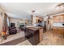 241 Covewood Circle Ne, Calgary, AB  - Indoor Photo Showing Kitchen With Fireplace With Double Sink 