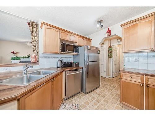 241 Covewood Circle Ne, Calgary, AB - Indoor Photo Showing Kitchen With Double Sink