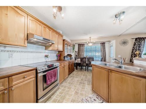 241 Covewood Circle Ne, Calgary, AB - Indoor Photo Showing Kitchen With Double Sink