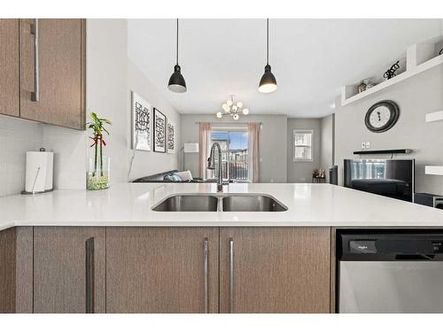 129-30 Cornerstone Manor Ne, Calgary, AB - Indoor Photo Showing Kitchen With Double Sink With Upgraded Kitchen