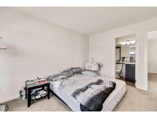 28 Edith Gate Nw, Calgary, AB - Indoor Photo Showing Bedroom