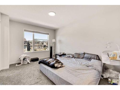 28 Edith Gate Nw, Calgary, AB - Indoor Photo Showing Bedroom