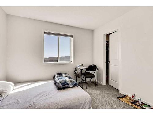 28 Edith Gate Nw, Calgary, AB - Indoor Photo Showing Bedroom