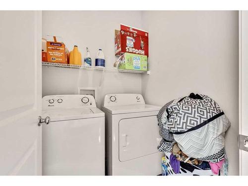 28 Edith Gate Nw, Calgary, AB - Indoor Photo Showing Laundry Room