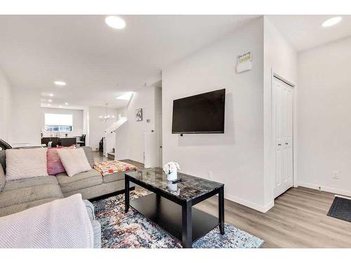 28 Edith Gate Nw, Calgary, AB - Indoor Photo Showing Living Room