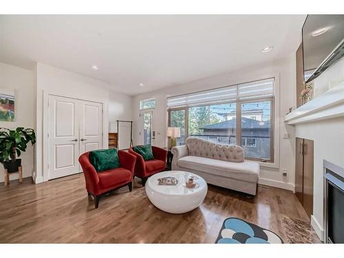 528 31 Street Nw, Calgary, AB - Indoor Photo Showing Living Room With Fireplace