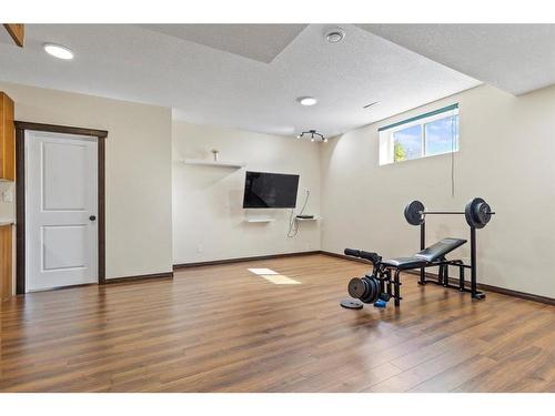 1218 Kingston Crescent Se, Airdrie, AB - Indoor Photo Showing Gym Room