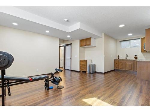 1218 Kingston Crescent Se, Airdrie, AB - Indoor Photo Showing Gym Room