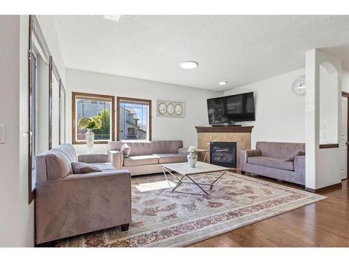 1218 Kingston Crescent Se, Airdrie, AB - Indoor Photo Showing Living Room With Fireplace