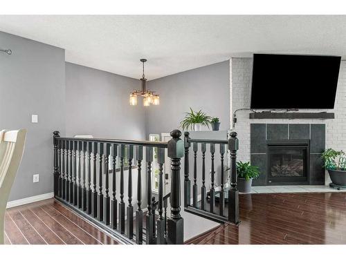 31 Woodglen Road Sw, Calgary, AB - Indoor Photo Showing Other Room With Fireplace