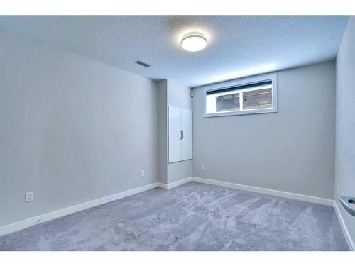 108 Rainbow Falls Grove, Chestermere, AB - Indoor Photo Showing Other Room