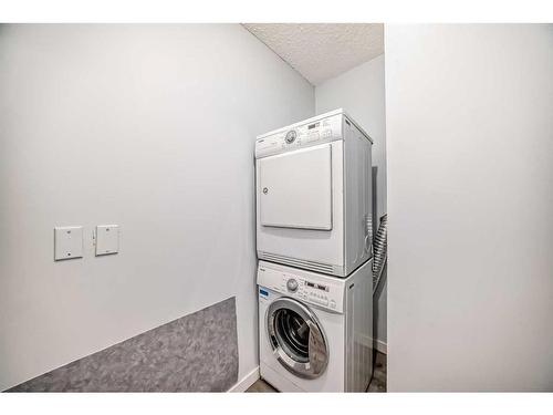 215-55 Arbour Grove Close Nw, Calgary, AB - Indoor Photo Showing Laundry Room