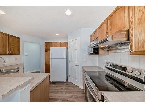 158 Coville Circle Ne, Calgary, AB - Indoor Photo Showing Kitchen With Double Sink