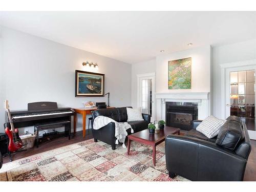 84 Hawkside Road Nw, Calgary, AB - Indoor Photo Showing Living Room With Fireplace