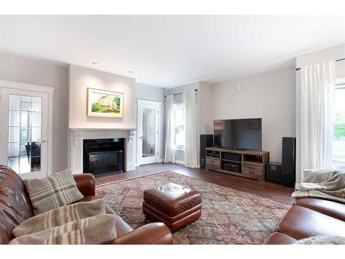 84 Hawkside Road Nw, Calgary, AB - Indoor Photo Showing Living Room With Fireplace