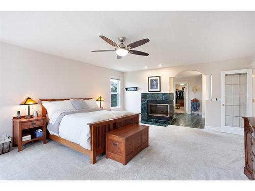 84 Hawkside Road Nw, Calgary, AB - Indoor Photo Showing Bedroom With Fireplace