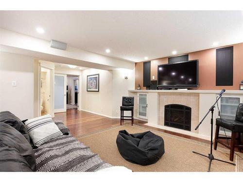 84 Hawkside Road Nw, Calgary, AB - Indoor Photo Showing Living Room With Fireplace