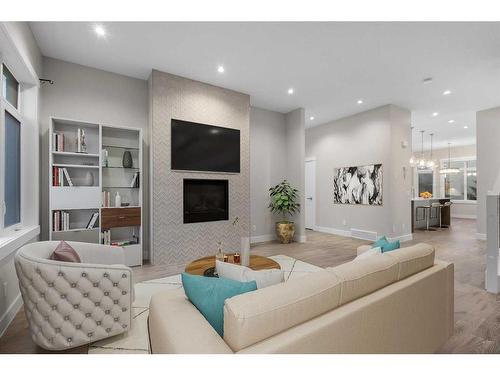 92 Burma Star Road Sw, Calgary, AB - Indoor Photo Showing Living Room With Fireplace