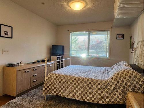 1118-950 Arbour Lake Road Nw, Calgary, AB - Indoor Photo Showing Bedroom