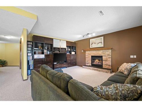 160 Douglas Woods Grove Se, Calgary, AB - Indoor Photo Showing Living Room With Fireplace