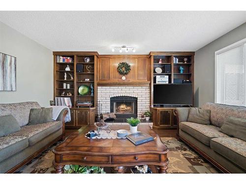 160 Douglas Woods Grove Se, Calgary, AB - Indoor Photo Showing Living Room With Fireplace