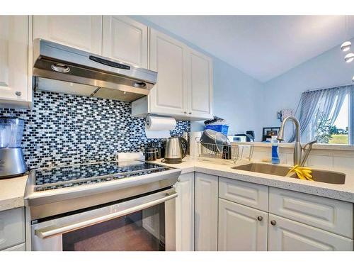 46 Anaheim Place Ne, Calgary, AB - Indoor Photo Showing Kitchen With Double Sink