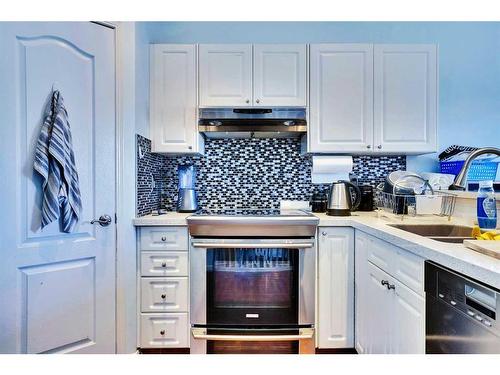 46 Anaheim Place Ne, Calgary, AB - Indoor Photo Showing Kitchen With Double Sink