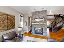 4628 Montgomery Avenue Nw, Calgary, AB  - Indoor Photo Showing Living Room With Fireplace 