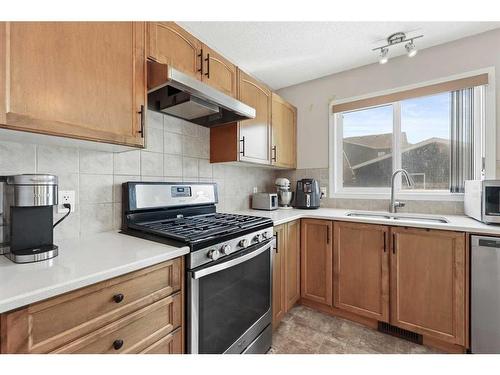 471 Auburn Bay Avenue Se, Calgary, AB - Indoor Photo Showing Kitchen With Double Sink